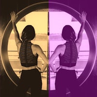 a woman is standing in front of a circular mirror